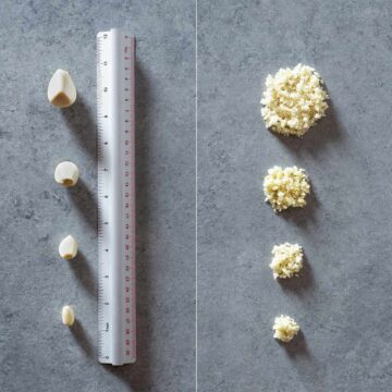 Garlic cloves whole and mined with a ruler.