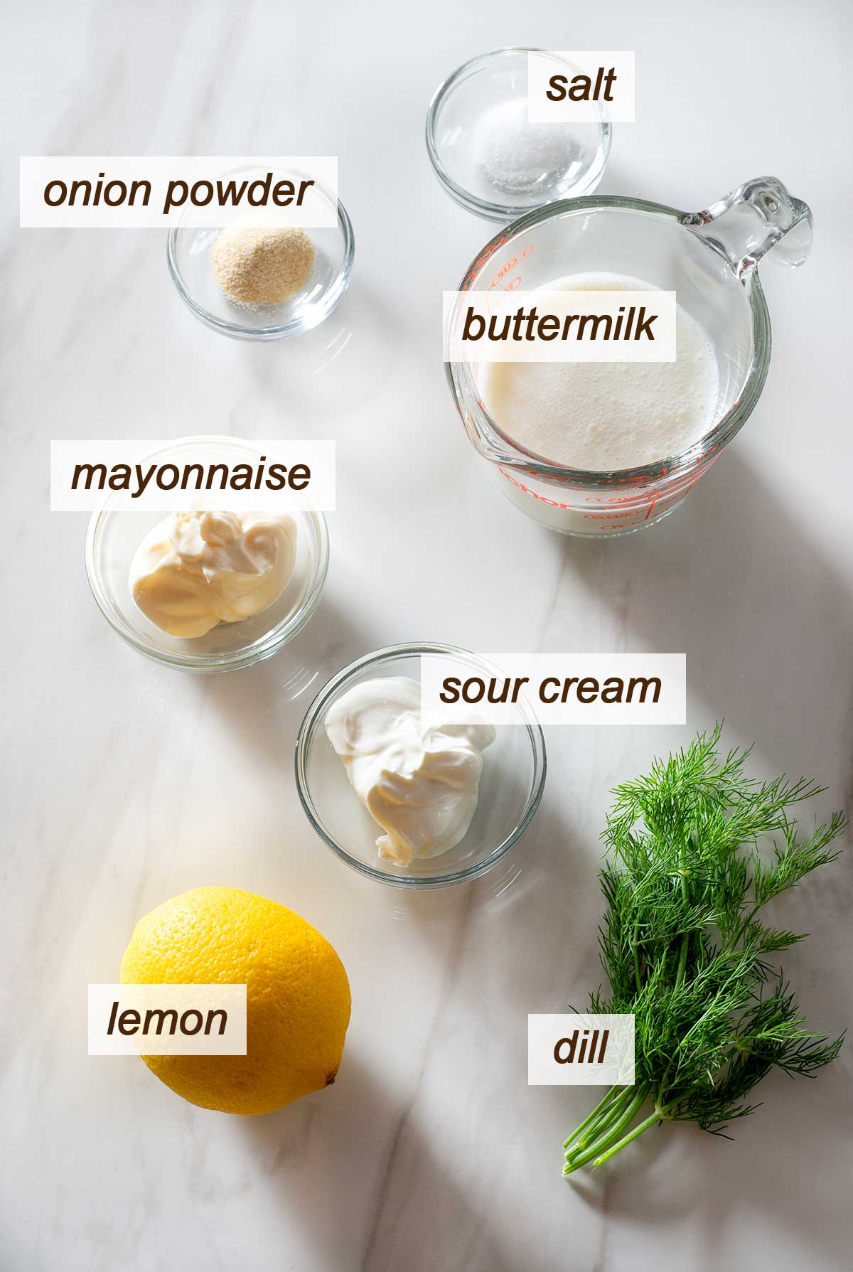 Buttermilk, salt, onion powder, mayonnaise, sour cream, lemon and dill.