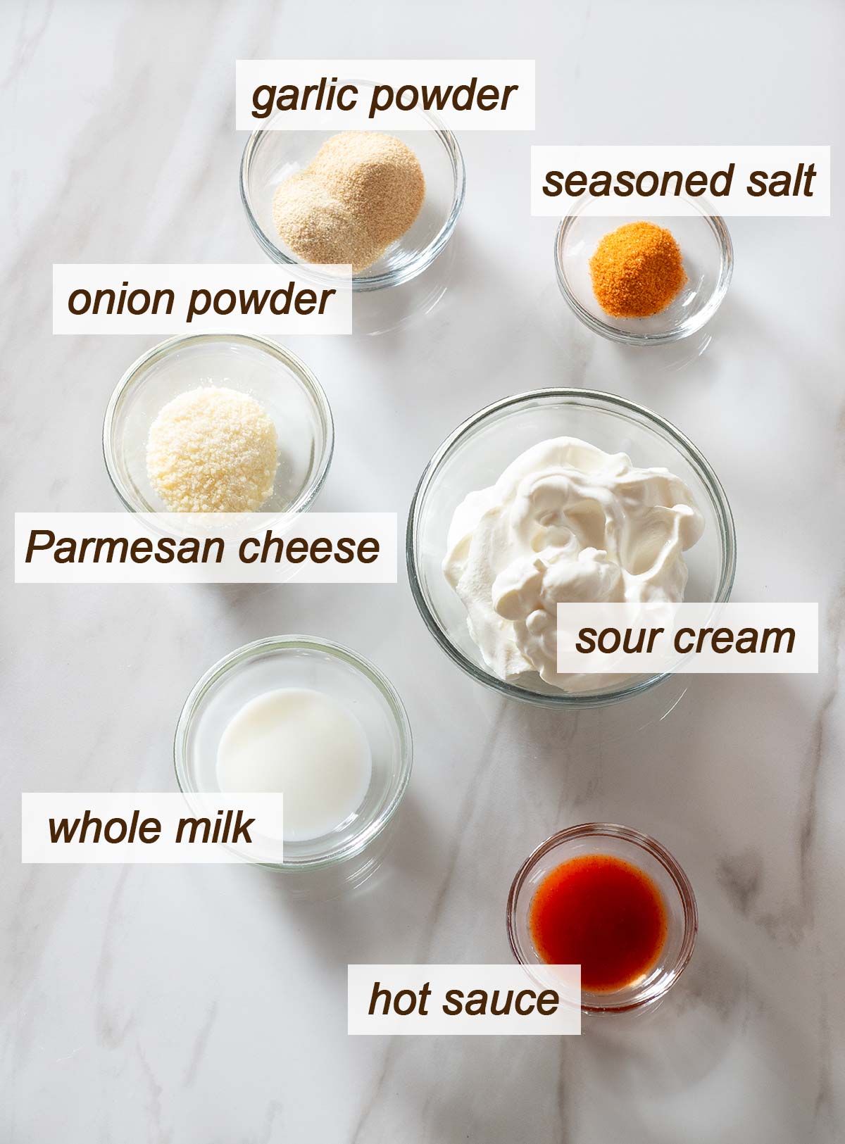 Sour cream, seasoned salt, hot sauce, milk, Parmesan, garlic powder and onion powder.