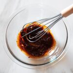 Ancho marinade being whisked in a bowl.