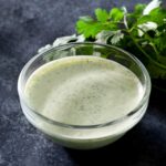 Creamy cilantro dipping sauce in a bowl.