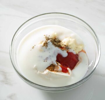Spicy ranch dressing ingredients in a bowl.