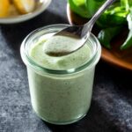 Basil mayo dressing in a jar.