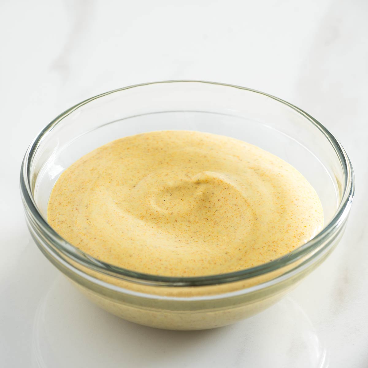 Curry mayo in a bowl.