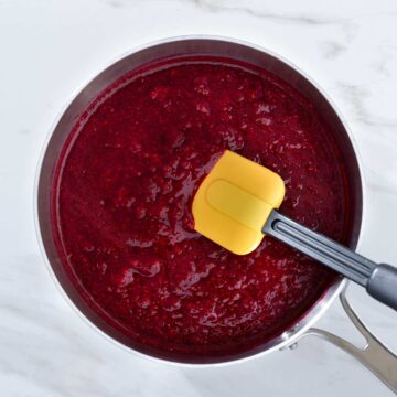 Raspberry sauce in a saucepan.