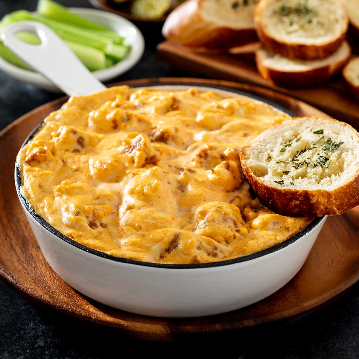 Spicy Italian sausage dip in a cast iron pan.