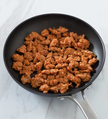 Cooked Italian sausage in a pan.