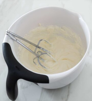 Whipped cream cheese and sour cream in a bowl.