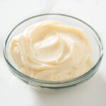Bourbon cream cheese frosting in a bowl.