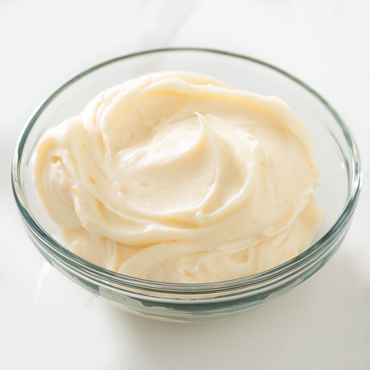 Bourbon cream cheese frosting in a bowl.