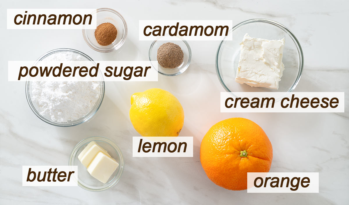 Orange, lemon, butter, cream cheese, cinnamon, cardamom and powdered sugar.
