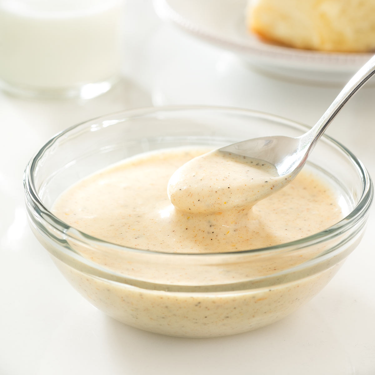 Spiced orange cream cheese glaze in a bowl.