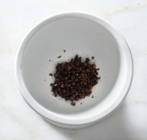 Crushed spices in a mortar.