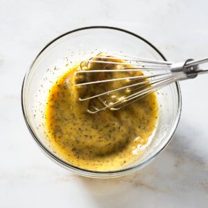 Marinade being whisked in a bowl.