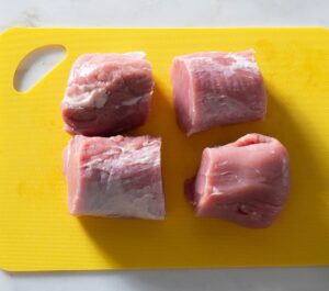 Four pieces of pork tenderloin.