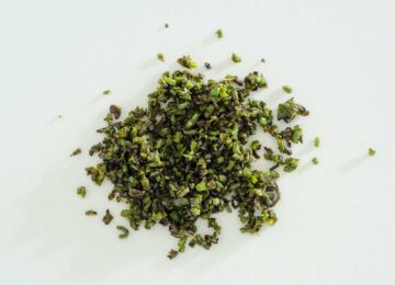 Chopped charred jalapeno peppers.