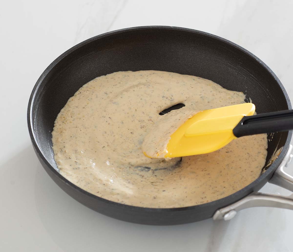 Cream sauce in a pan.