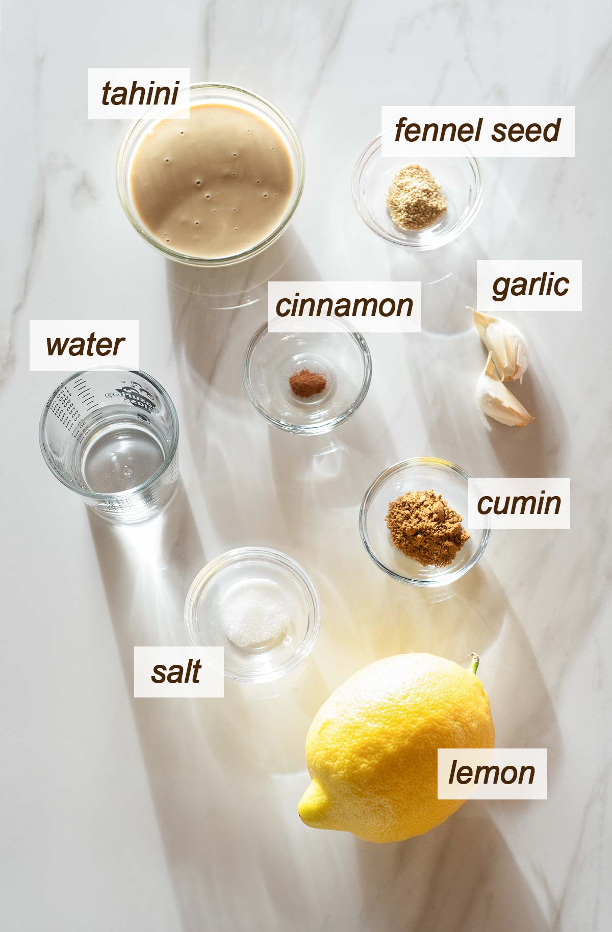 Tahini, garlic, fennel seed, cinnamon, cumin, water, salt and lemon.