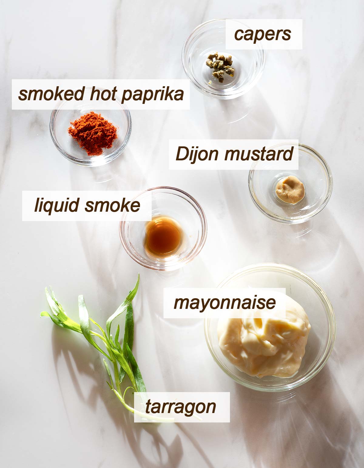 Mayonnaise, tarragon, liquid smoke, smoked hot paprika, Dijon and capers.