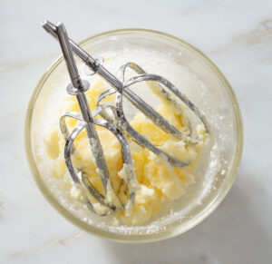 Creamed butter and sugar in a bowl.