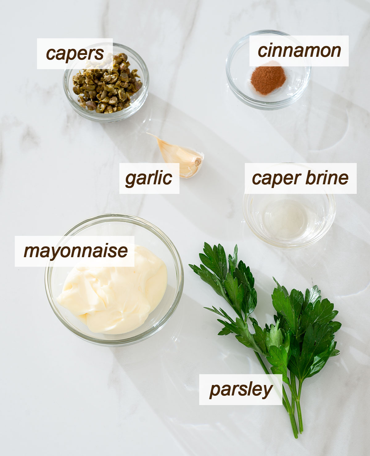 Mayonnaise, capers, caper brine, garlic, parsley and cinnamon.