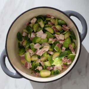 Brussels sprouts and bacon in a Dutch oven.